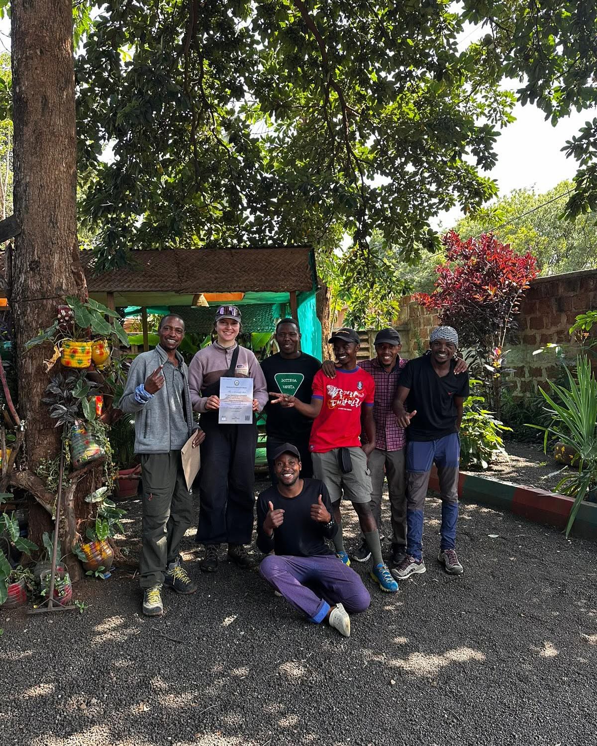Guides and a guest celebrating after a climb